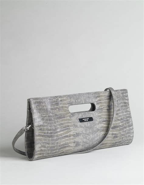 does michael kors use fake snake skin clutch|are michael kors bags genuine.